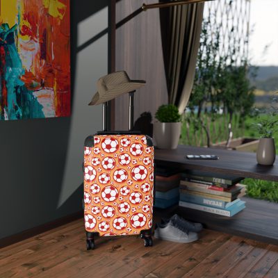 Soccer Suitcase - A luggage adorned with a sporty soccer-themed design, perfect for travelers who want to travel in style with their favorite sport.