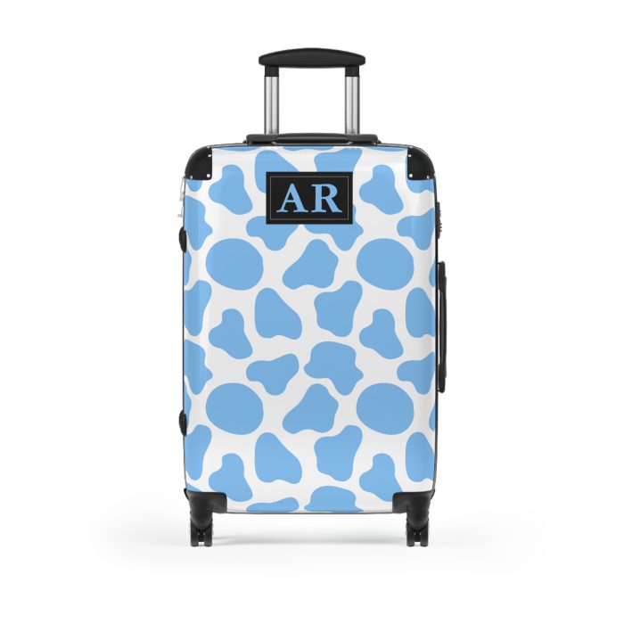 Custom Cow Print Suitcase - A personalized luggage adorned with a unique cow print design, perfect for travelers who want to add a touch of individuality to their journeys.